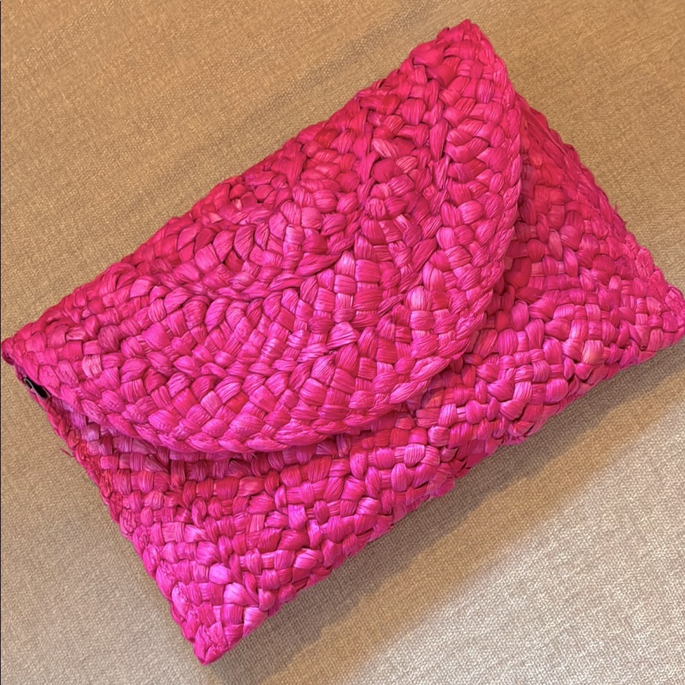 Pink woven straw clutch purse
